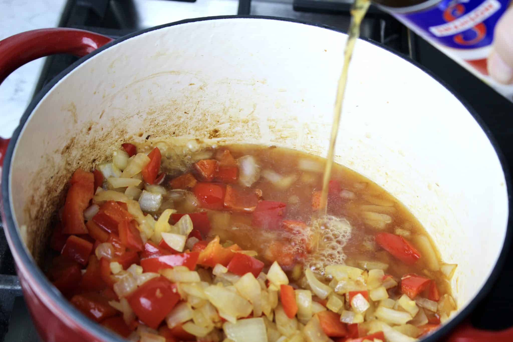 beef broth being added to taco soup
