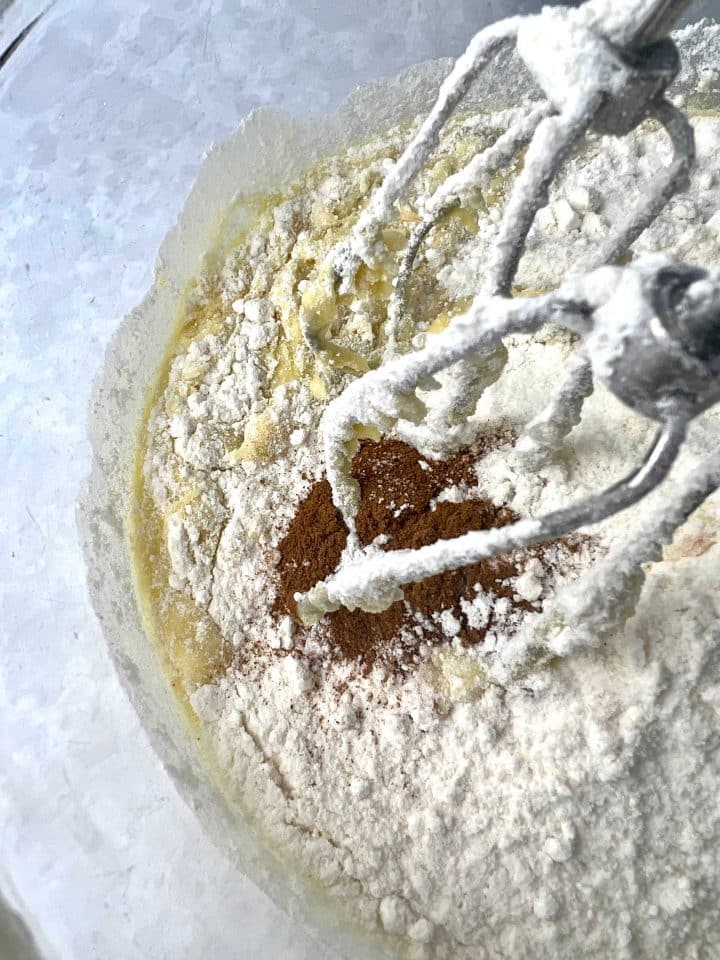 mixing cinnamon into cake mix and into banana mixture