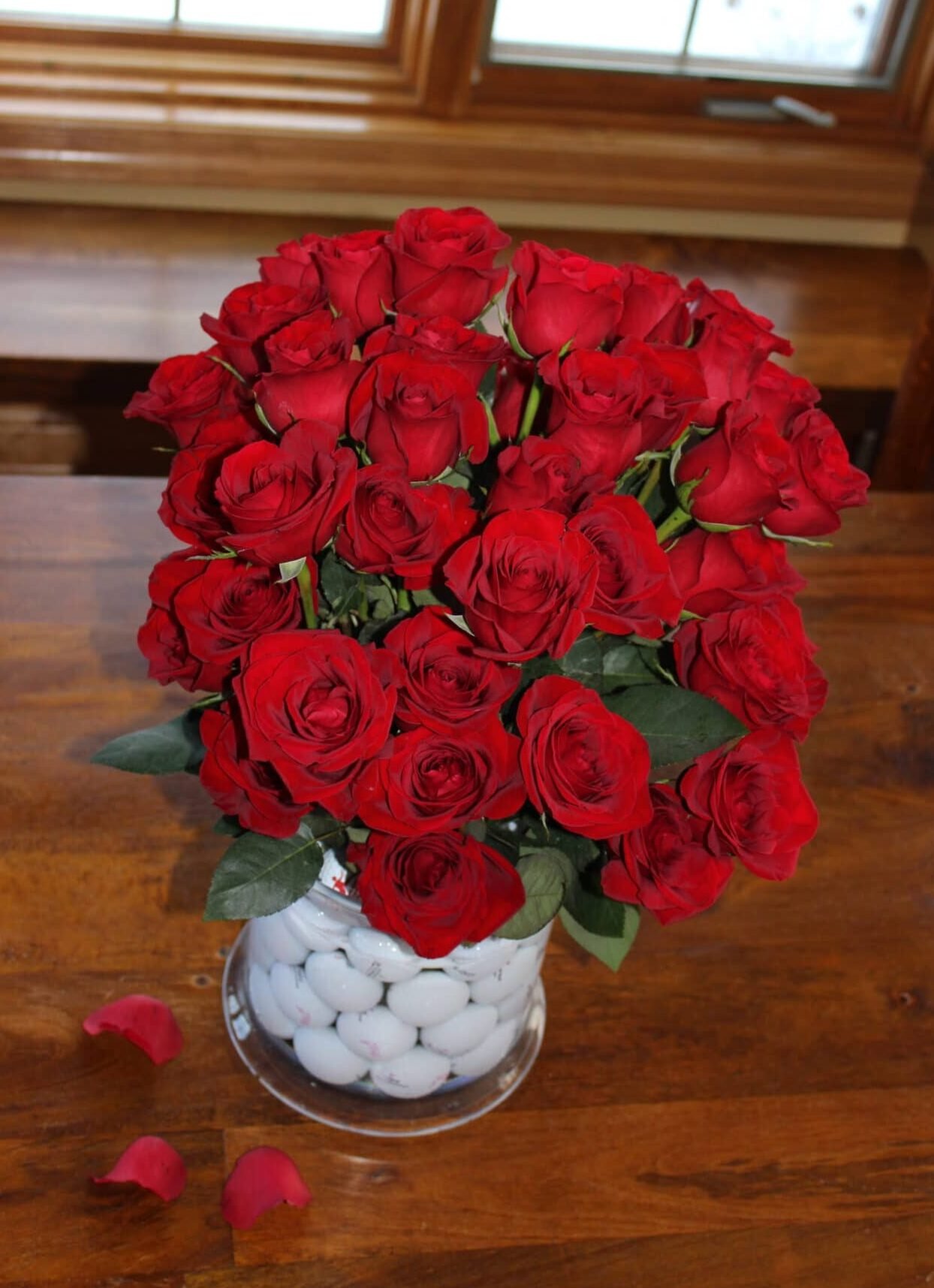vase with golf balls and roses