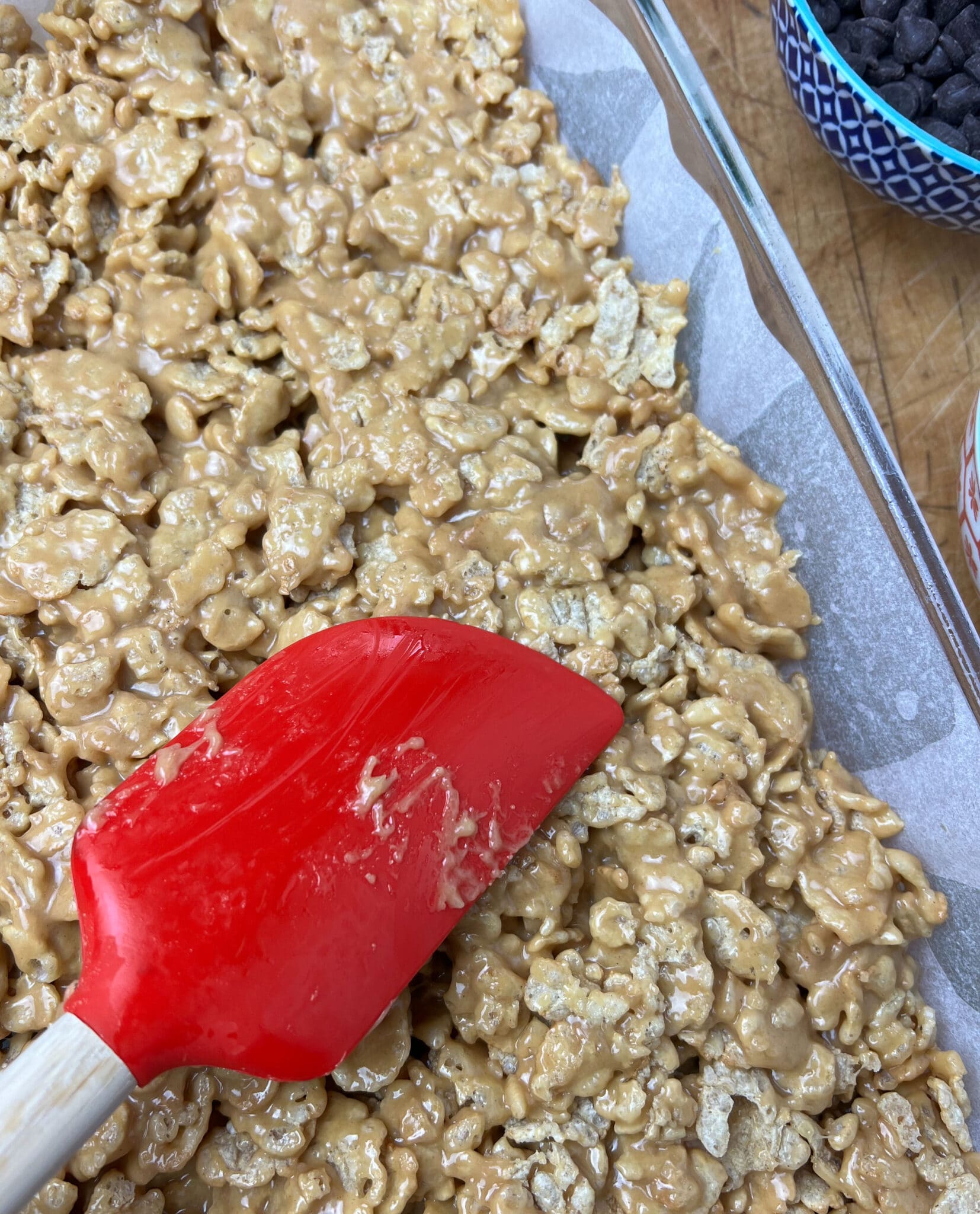 smoothing the special K cereal and peanut butter layer