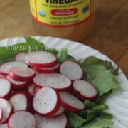 sliced radishes on a bed of lettuce