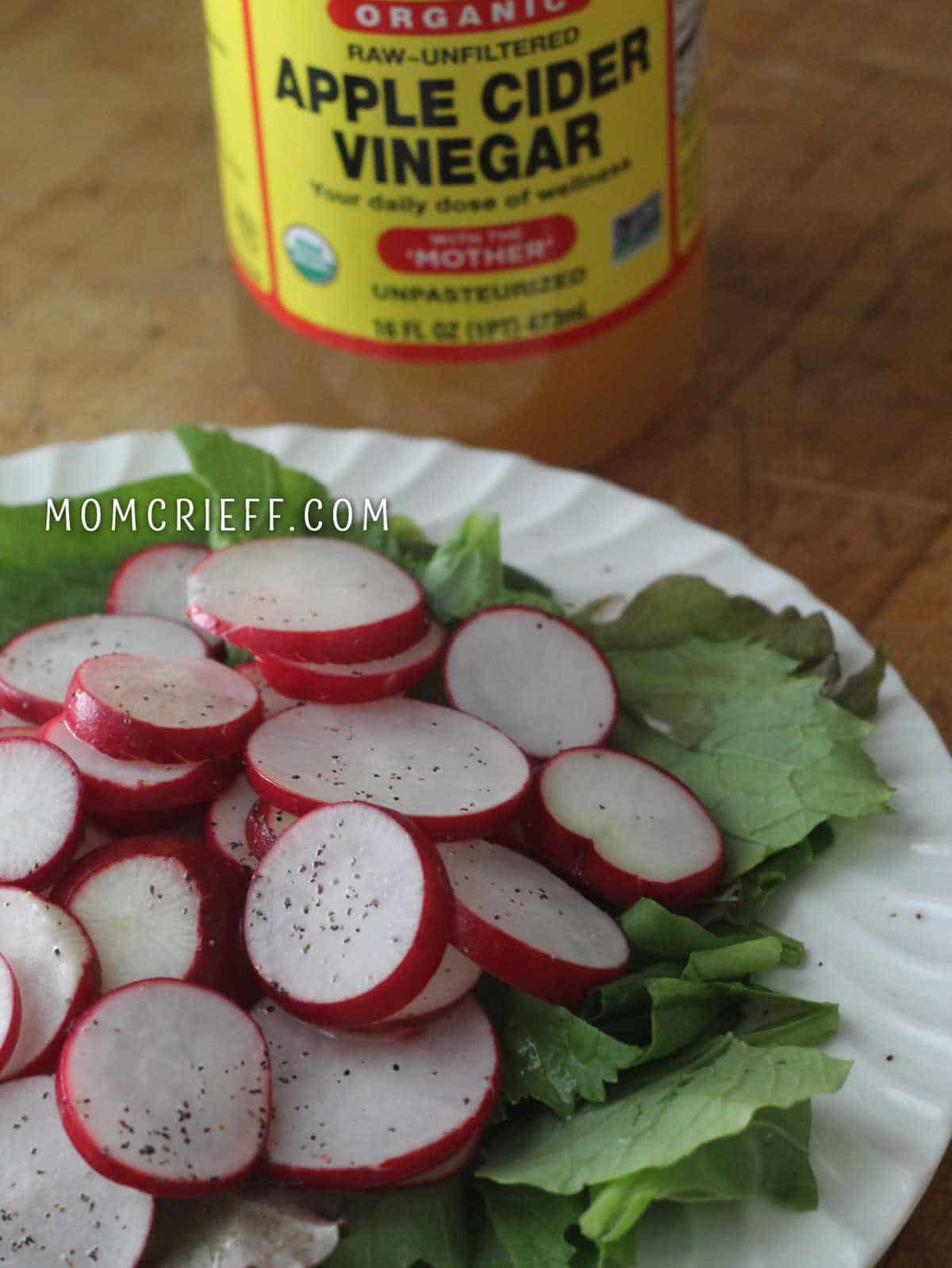 sliced radishes on a bed of lettuce