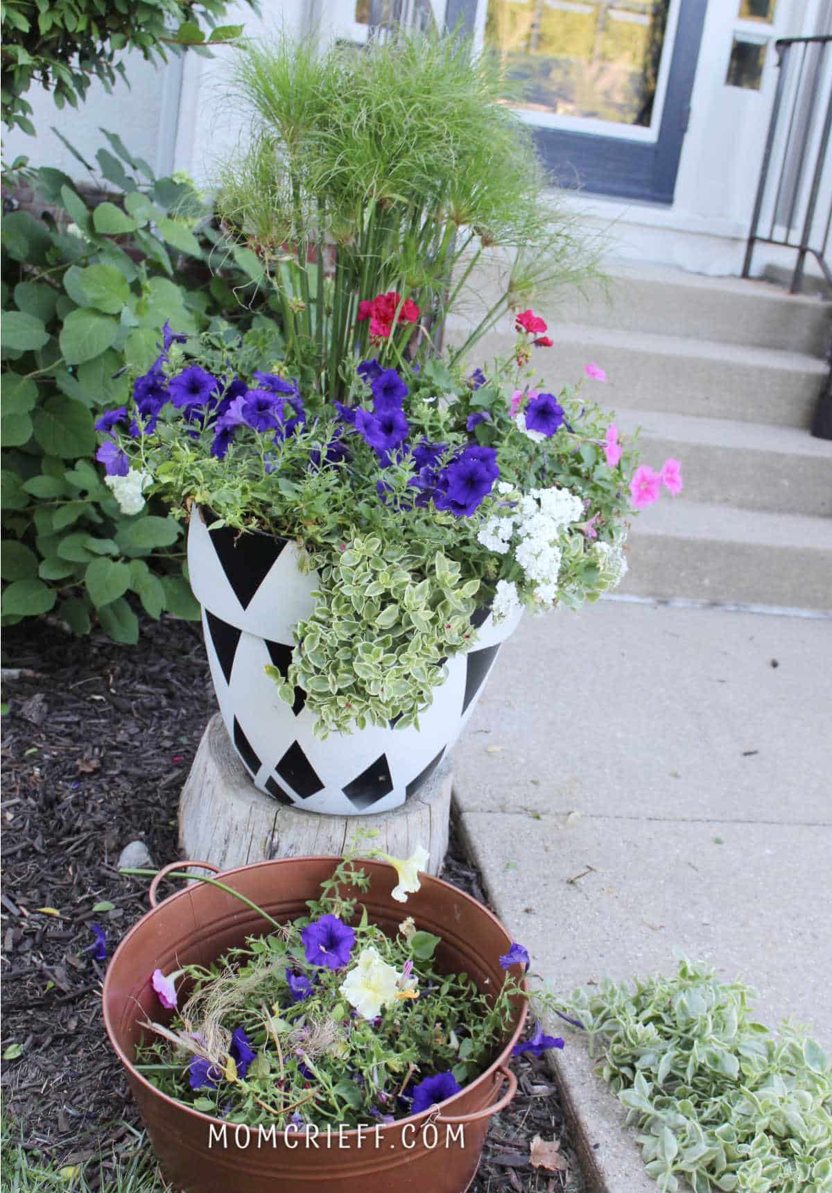 trimmed planter with trimmings in a full bucket