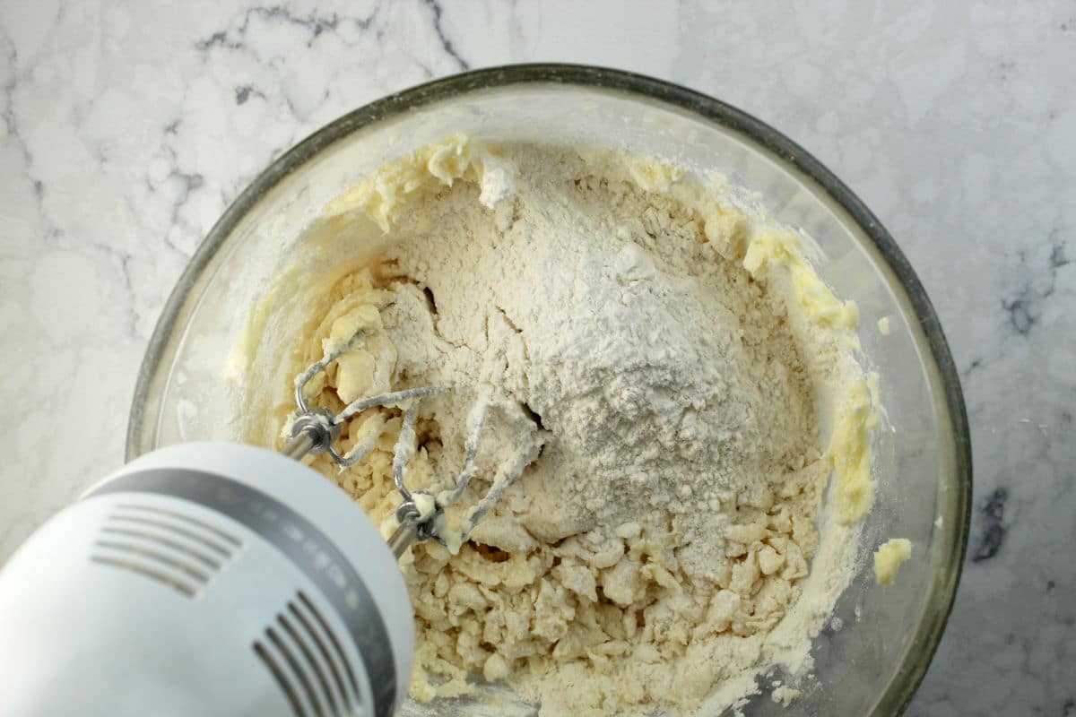 mixing shortbread cookie dough with a hand mixer