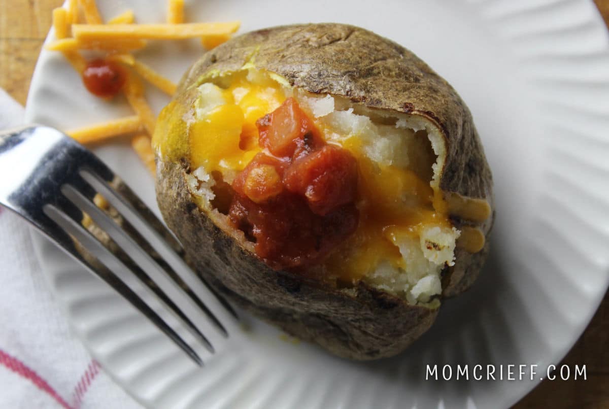 baked potato with melted cheddar and salsa