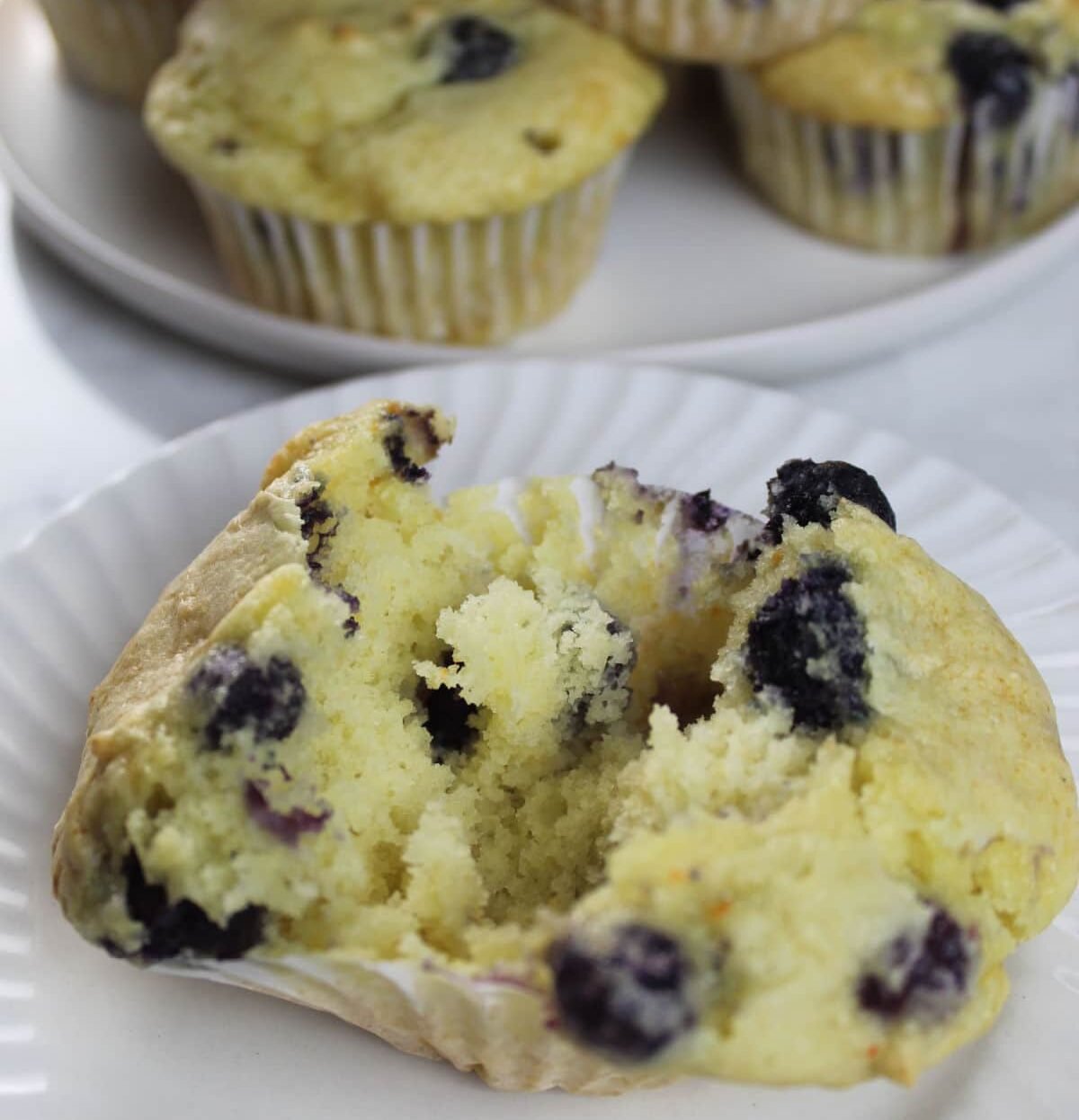 three ingredient blueberry muffin split open to see inside of the blueberry muffin.