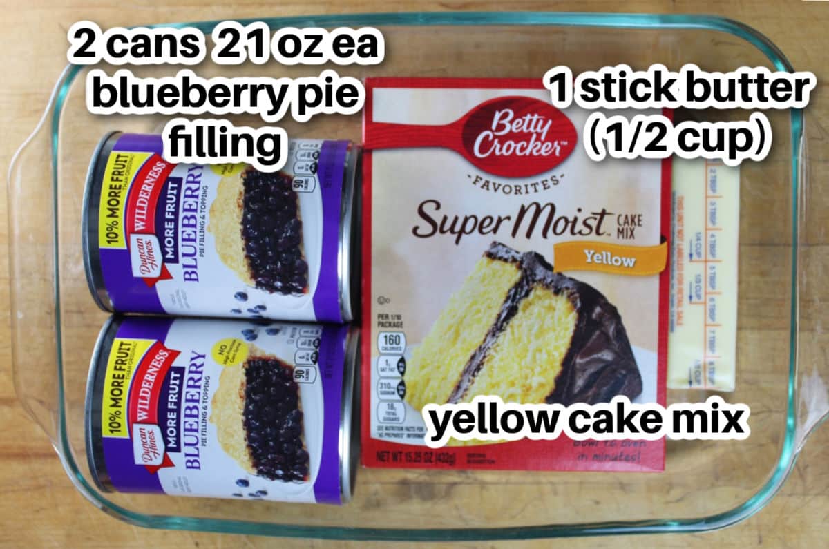 ingredients for three ingredient blueberry cobbler.  cake mix, cans of pie blueberries and one stick of butter.