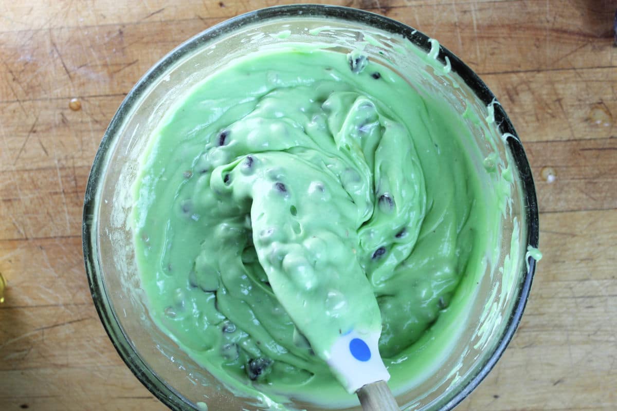 fold in chocolate chip cookies into green pistachio cake batter