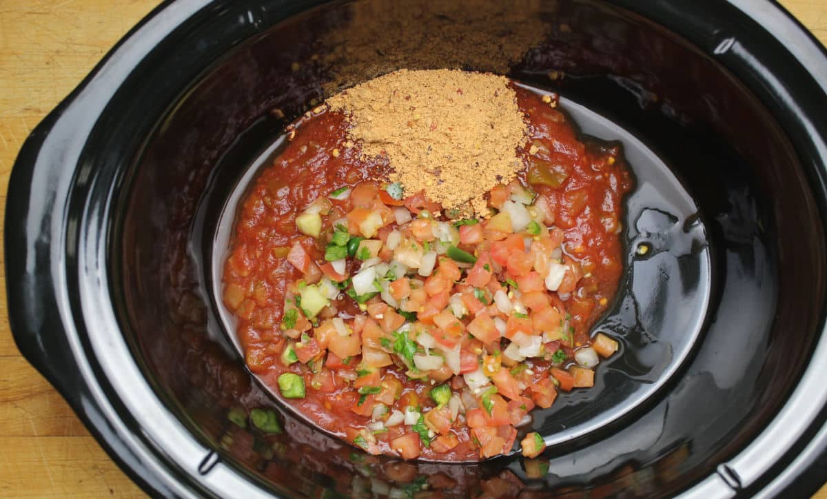 taco seasoning, pico de galla, salsa and juice of a lime to season chicken in slow cooker.
