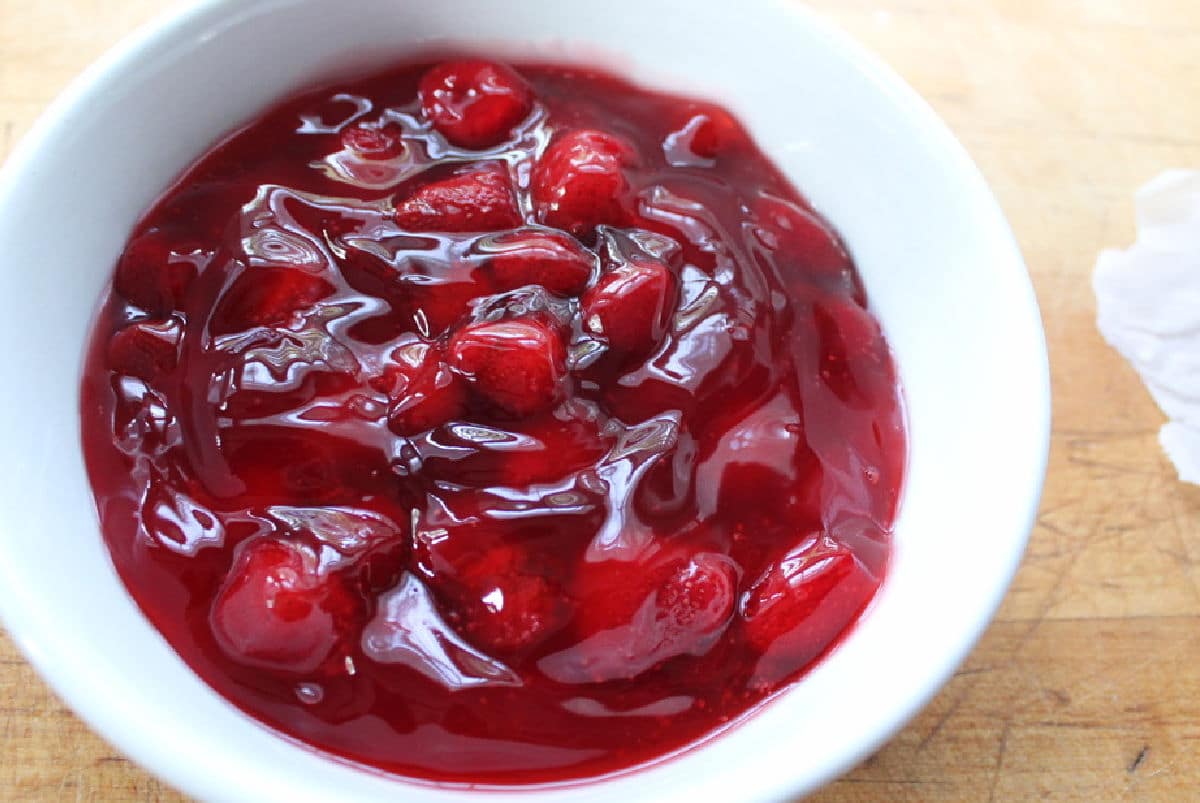 canned strawberry pie filling in a white bowl