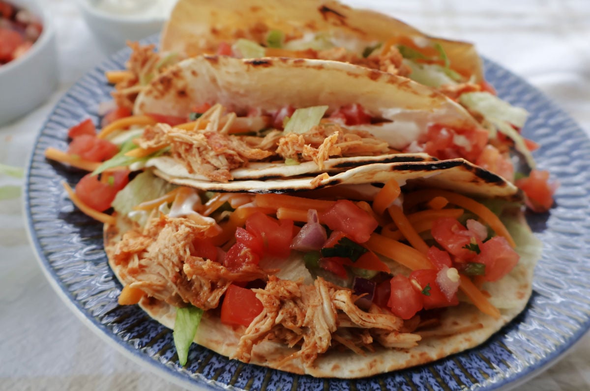 Shredded chicken tacos with pico de gallo, salsa, and shreded chicken