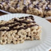 Cheerio cereal and marshmallow bar with chocolate drizzle.