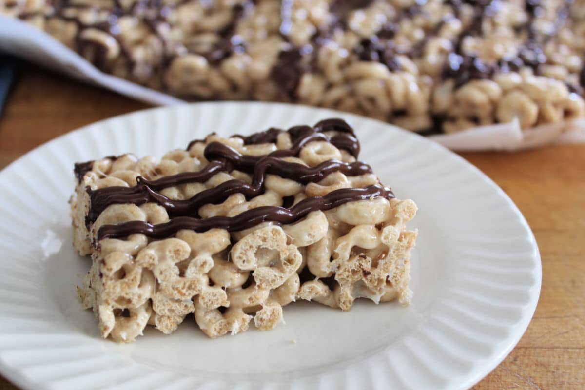 Cheerio cereal and marshmallow bar with chocolate drizzle.