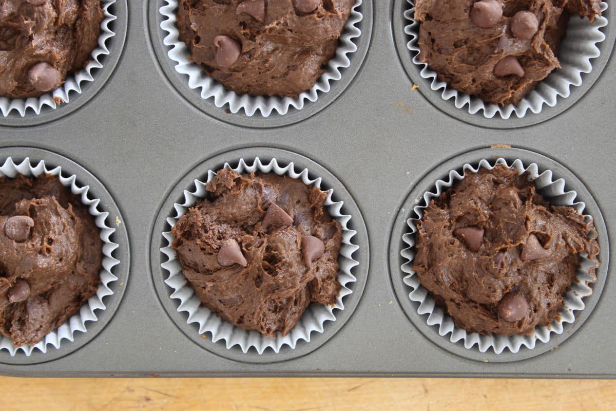 chocolate and pumpkin batter in muffin tin.