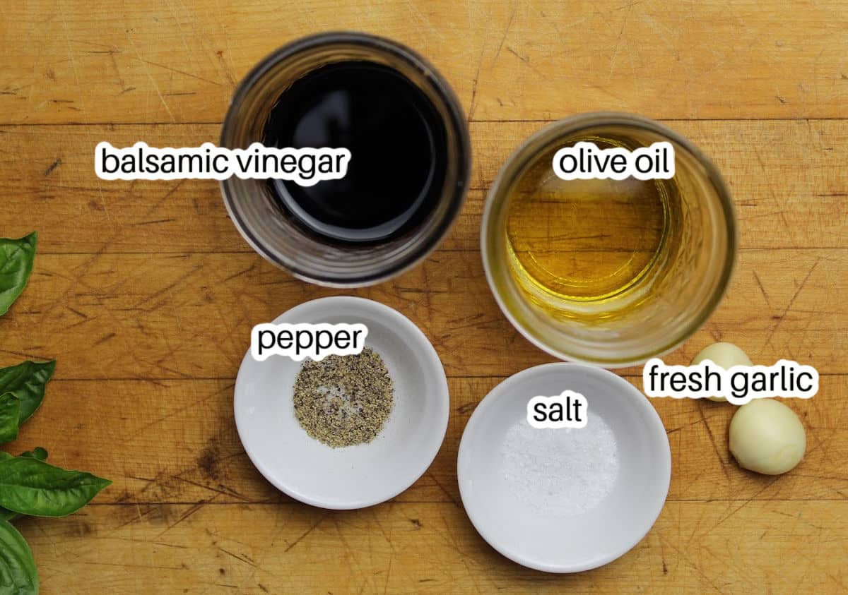 ingredients to make dressing includes balsamic vinegar, olive oil, pepper, salt and fresh garlic.