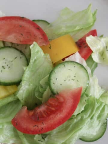Dill vinaigrette dressing on a fresh salad.