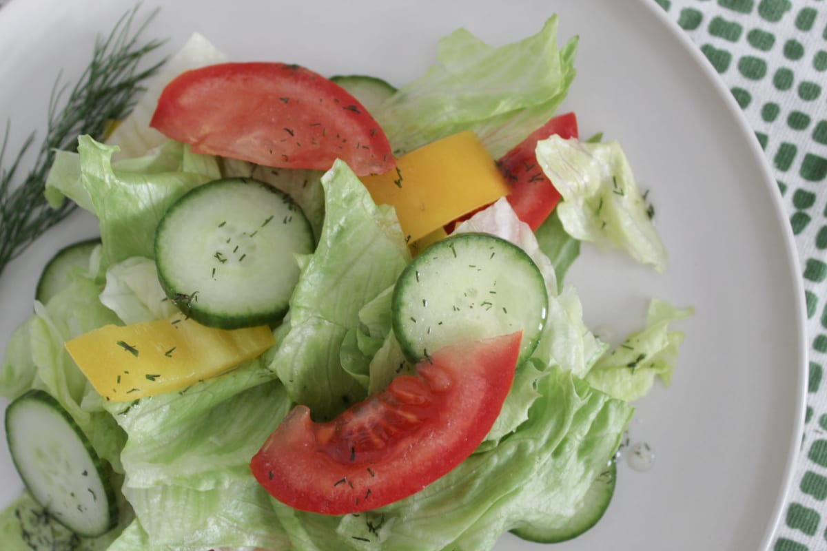Dill vinaigrette dressing on a fresh salad.