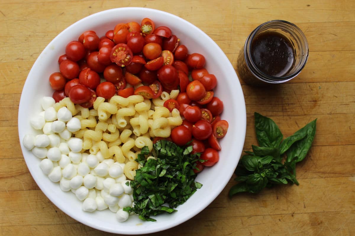 Pasta salad with cherry tomatos, pearl mozzarella, fresh basil and an easy vinaigrette.