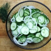 Cucumber salad with dill in a glass bowl