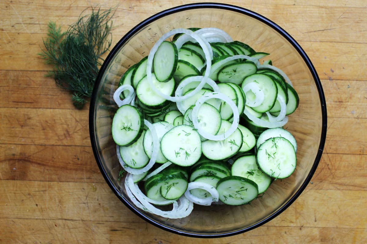 Cucumber salad with dill in a glass bowl