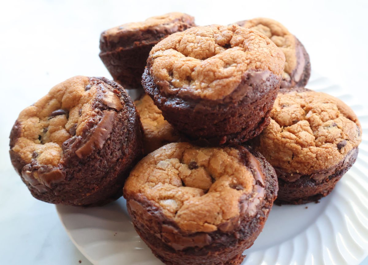 Brookies on a white plate.  Brookies are brownie on the bottom, cookies on the top.  Baked in a muffin tin.