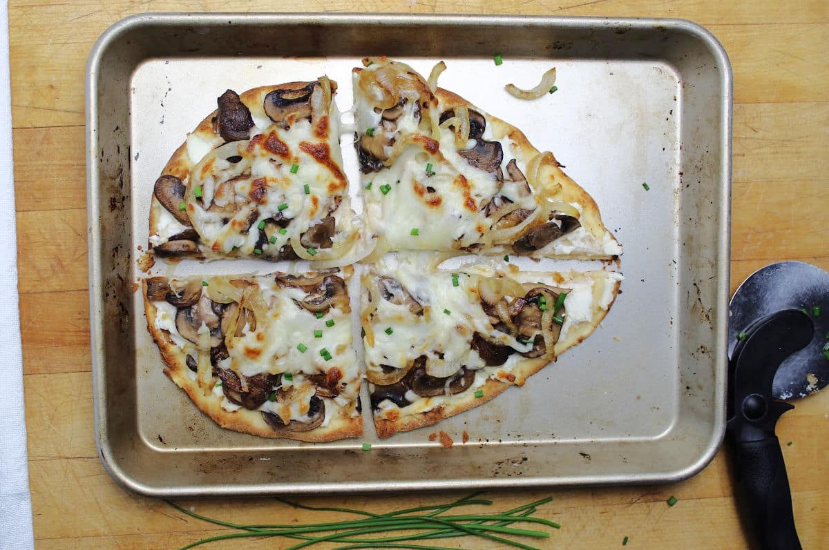 flatbread with sauteed onions and mushrooms with melted cheese.