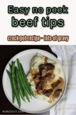 white plate with beef tips on gravy with a side of green beans. Text overlay states easy no peek beef tips , crock pot recipe, lots of gravy