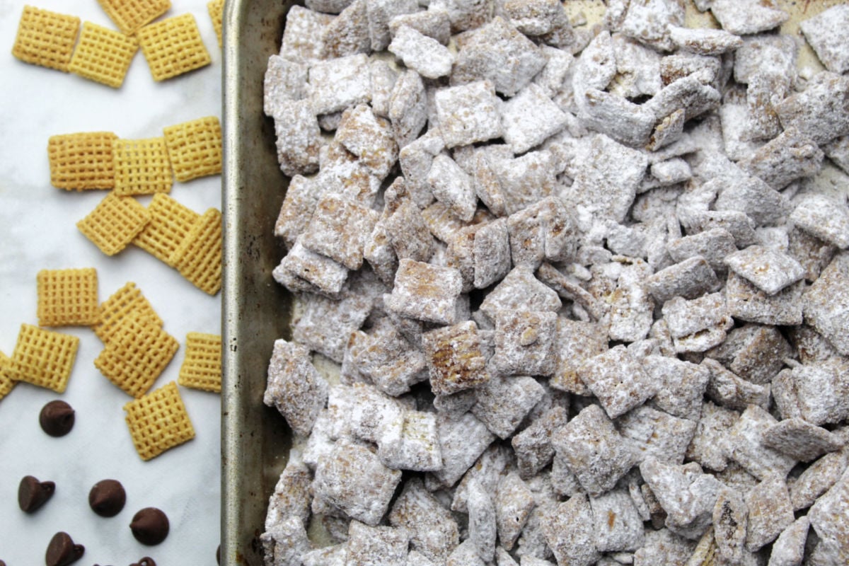 A batch of puppy chow on a baking tray.