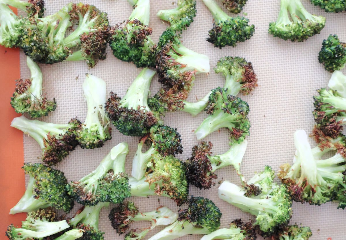 lightly charred broccoli on a sheetpan. 