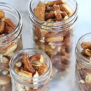 seasoned pretzel pieces in mason jars for gifts.