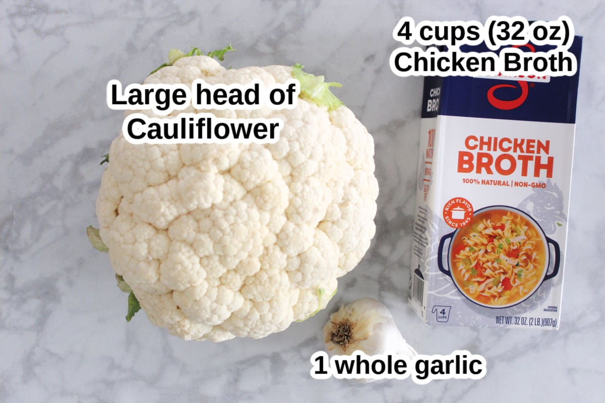 a head of cauliflower, a box of chicken stock and a whole head of garlic.