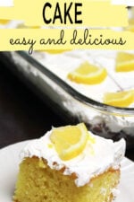 A piece of lemon poke cake garnished with whipped topping and a piece of fresh lemon.
