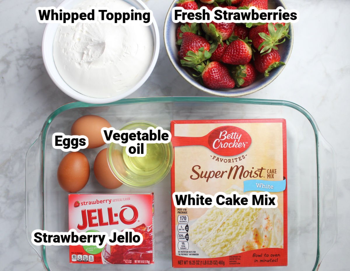 Ingredients for strawberry poke cake which include white cake mix, strawberry jello, whipped topping, fresh strawberries, eggs and vegetable oil.