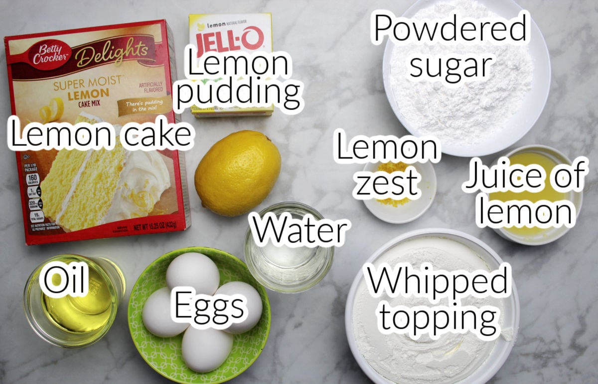 lemon poke cake ingredients including lemon cake, lemon pudding, fresh lemon zest and juice, oil, eggs, powdered sugar, and whipped topping. 