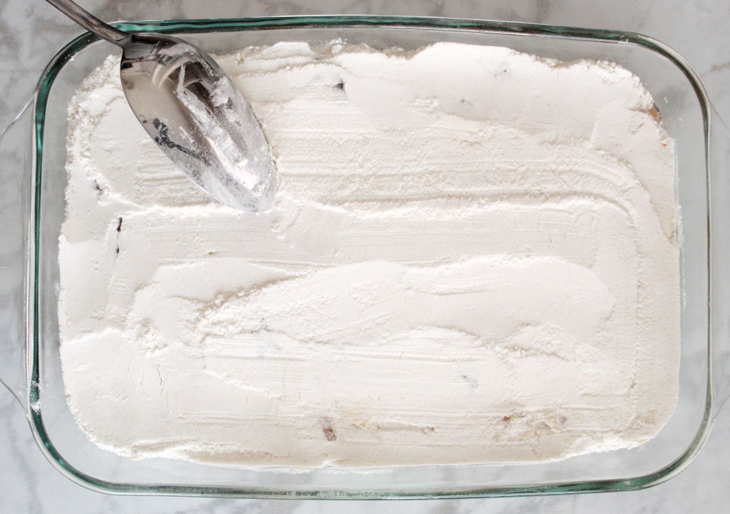 A smoothed layer of dry cake mix.