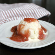 rhubarb sauce on a scoop of vanilla ice cream