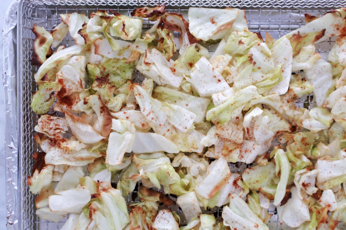Air fried cabbage with browned, crisp edges. Sprinkled with some paprika for color.