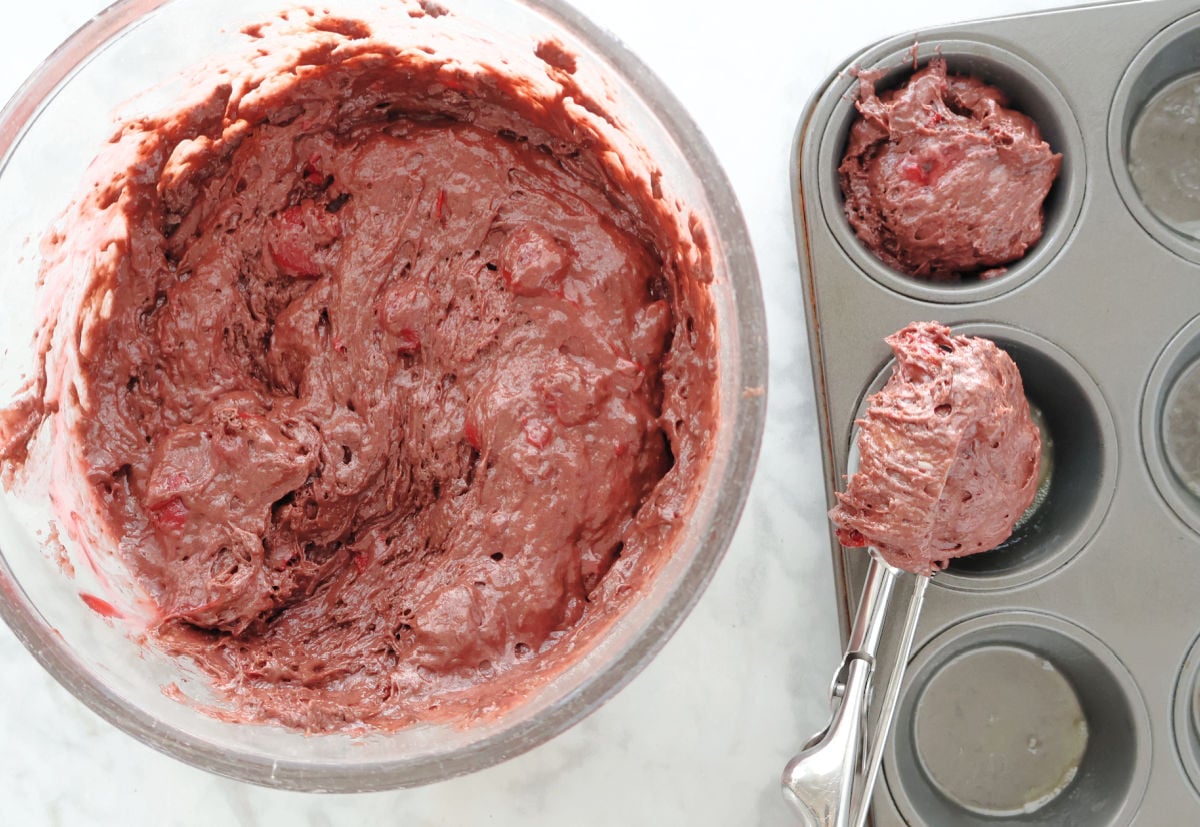 Scoop the three ingredient cherry chocolate batter into your muffin tin.
