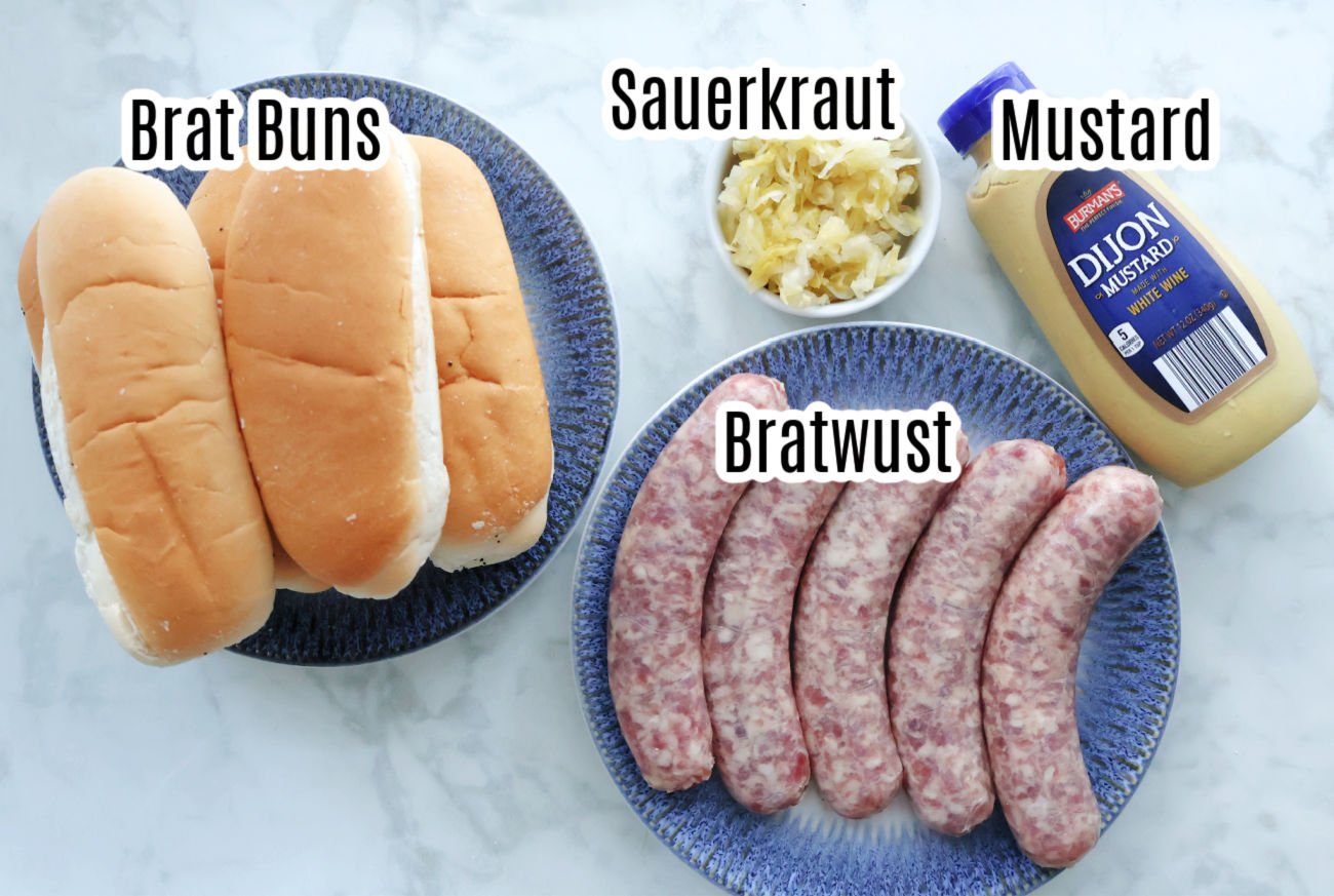 Air fryer brats include bratworst, brat buns, sauerkraut, dijon mustard