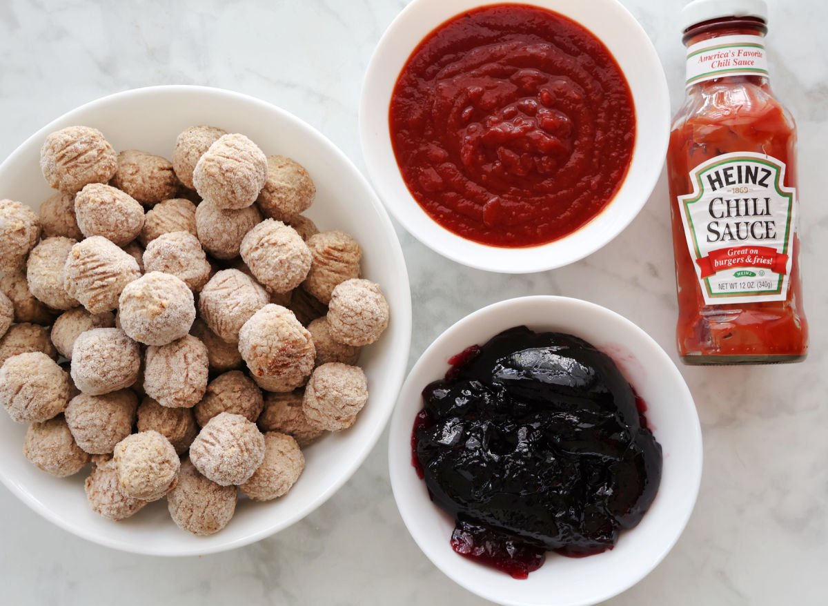 Ingredients for 3 ingredient meatbals which include frozen meatballs, grape jelly and Heinz Chili Sauce.