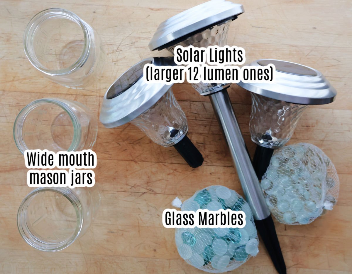 3 solar lights, 3 wide mouth mason jars, two bags of glass marbles.