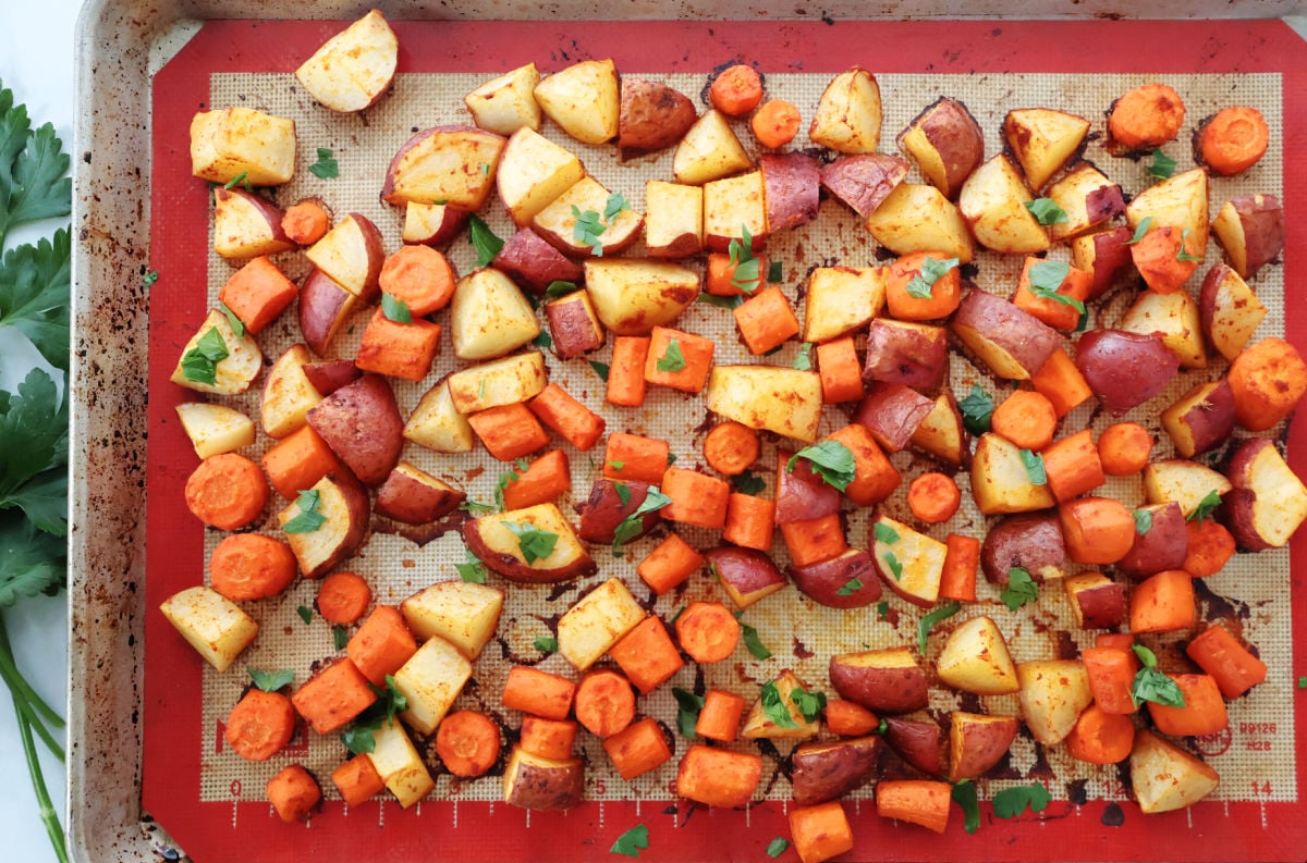 oven roasted carrots and red potatoes on a sheet pan