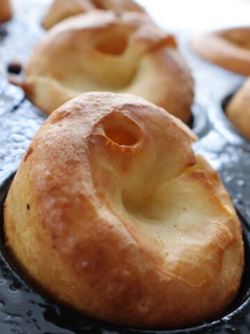 A puffy golden Yorkshire pudding fresh out of the oven.