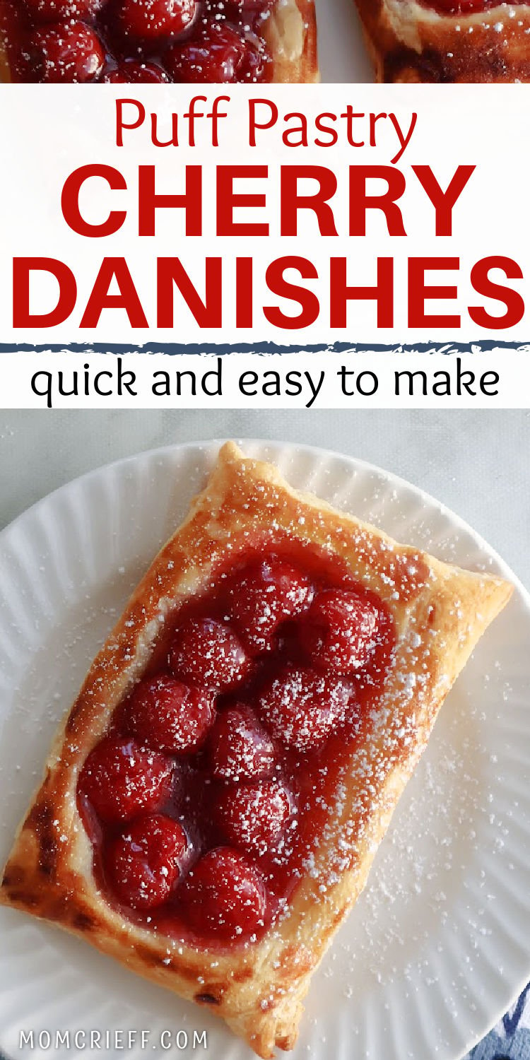 cherry danish made with puff pastry on a white plate.  Danish is dusted with powdered sugar making it even more delicious!