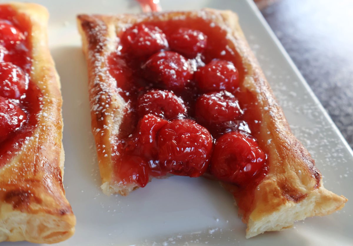 cherry danish with a bite out of it.