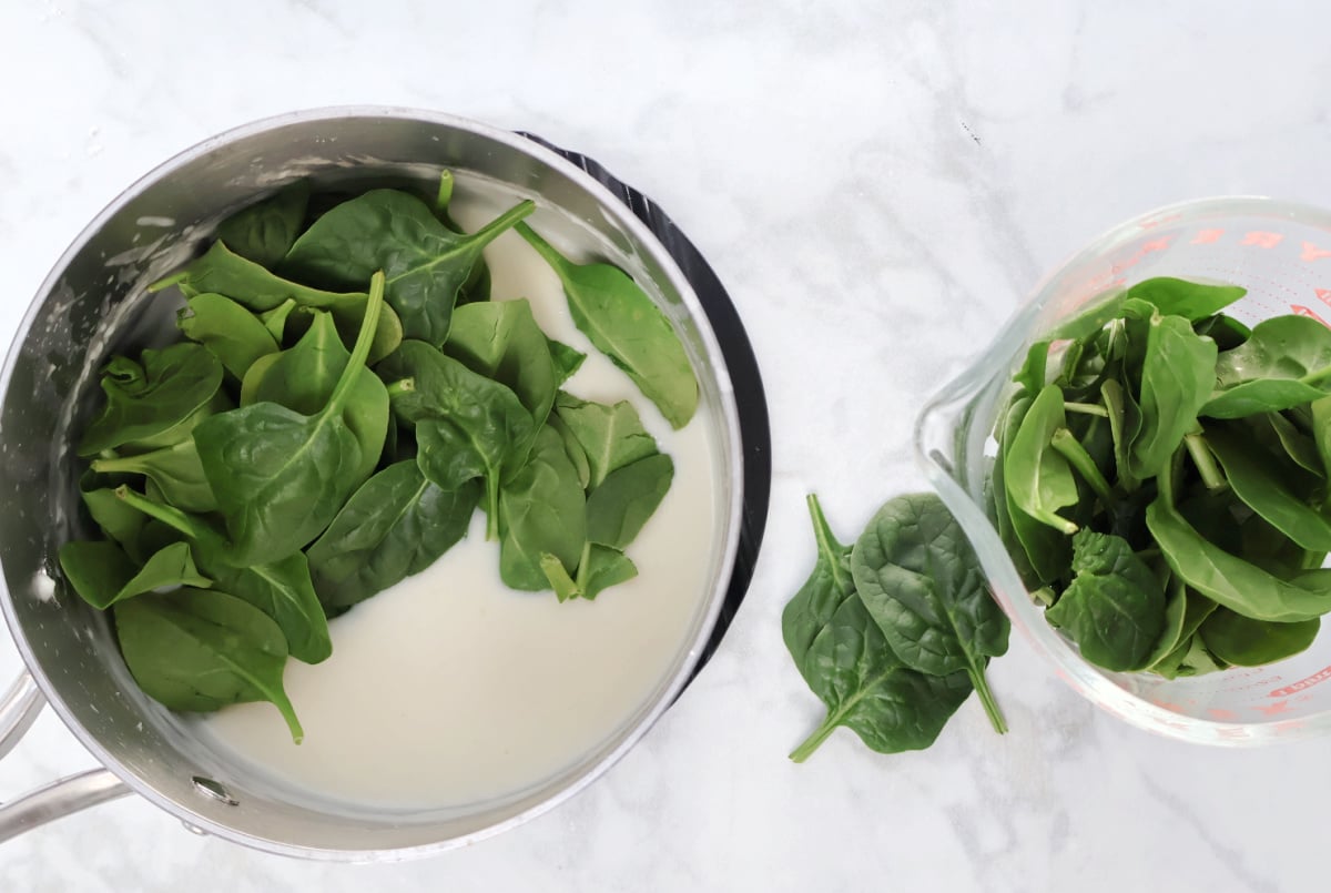 fresh spinach added into a freshly made swiss cheese sauce.