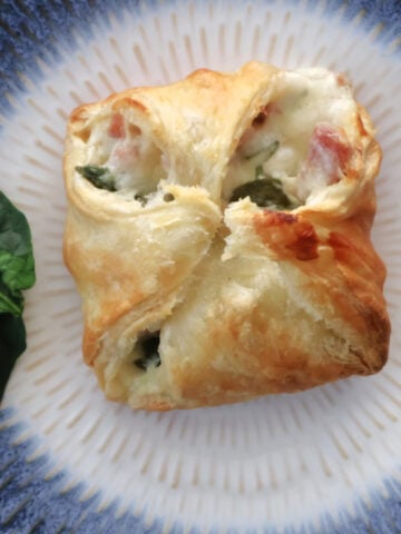 puff pastry folded onto a delicious ham, cheese sauce and spinach filling.