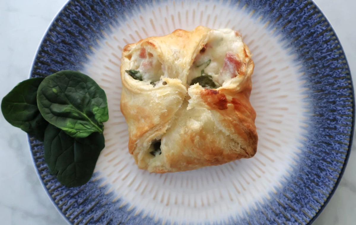 puff pastry folded onto a delicious ham, cheese sauce and spinach filling.