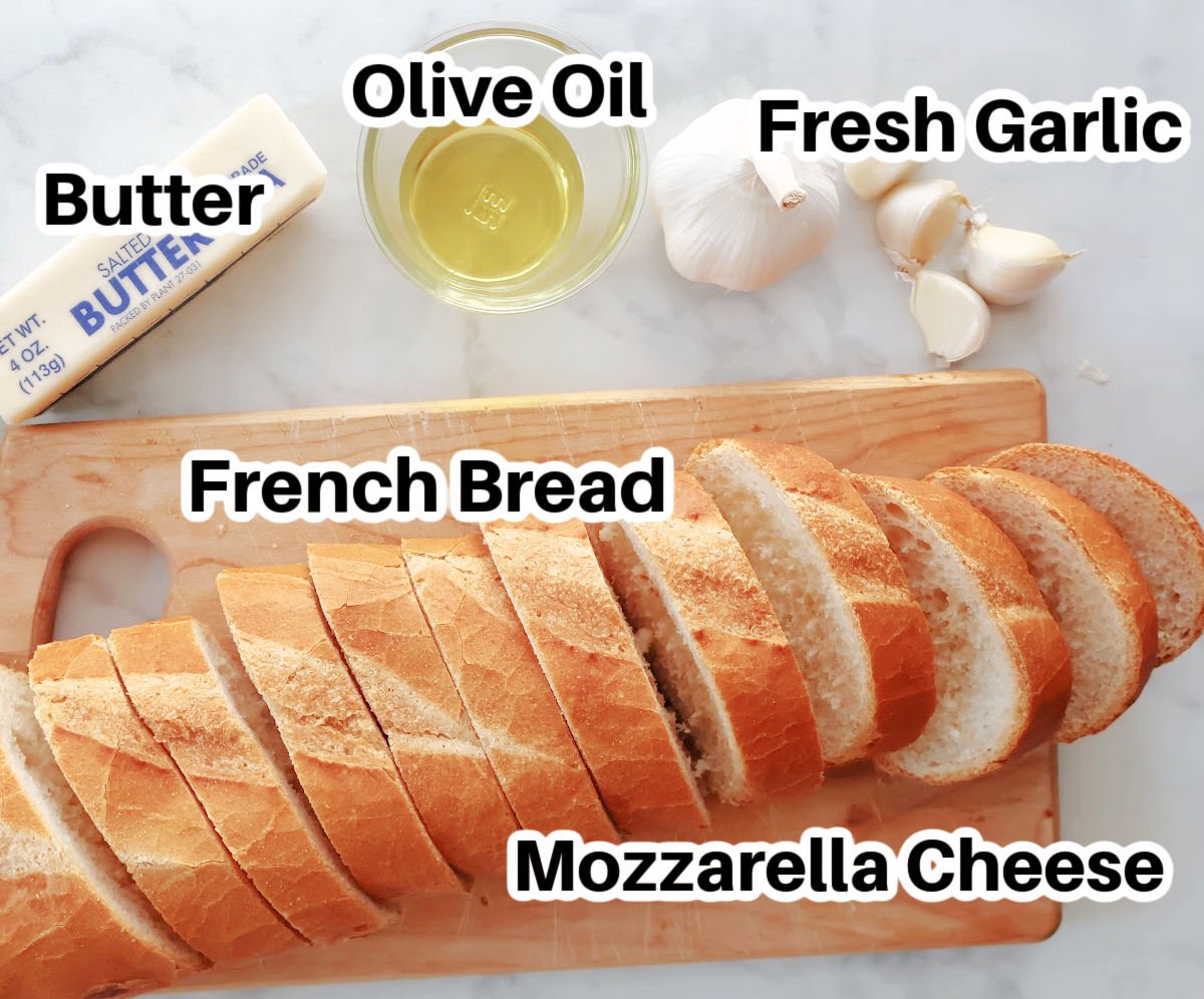 Delicious cheesy garlic bread made with french bread, butter, olive oil, fresh garlic and Mozzarella cheese.