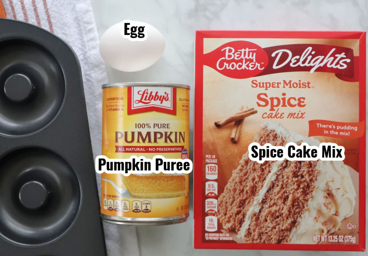 Ingredients for 3 ingredient pumpkin donuts which include Pumpkin Puree, Spice cake mix and an egg.